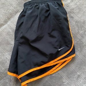 black and orange nike shorts